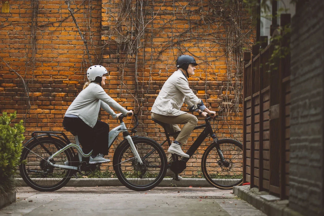 Class 1 e-bike riders on an urban bike lane for a Class 1 e-bike buying guide