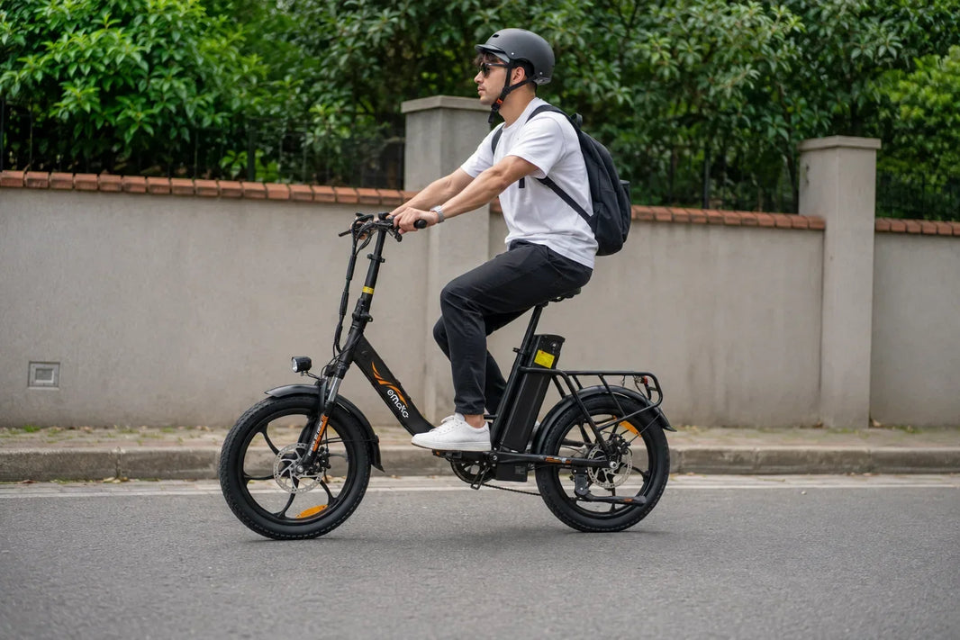Adult rider commuting on an EMOKO EC23 Pro electric bike on a residential street