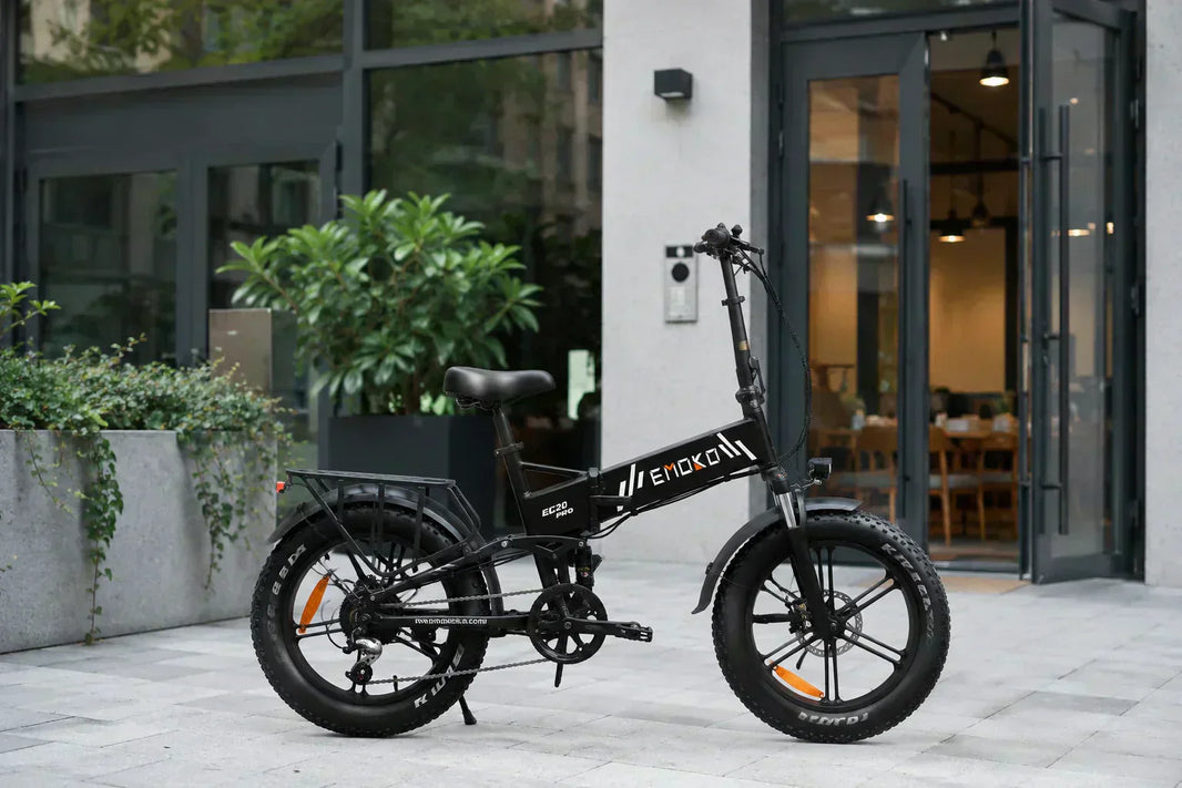 Commuter folding e-bike parked at a modern city entrance