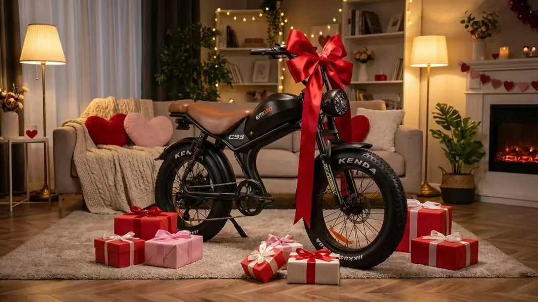 Happy couple riding matching Emoko fat tire electric bikes (C93 and EC20) on a scenic road at sunset, the perfect unique Valentine's Day gift for 2026.